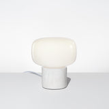 The Arca Petite Opalia Table Lamp Featuring a White Marble Base