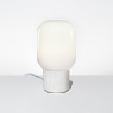 The Arca Tall Opalia Table Lamp Featuring a White Marble Base